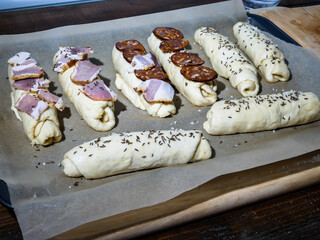 Bread stick dough covered with ingredients