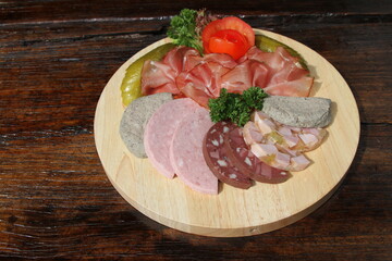 Bauernvesper, German farmer's meal with Black Forest ham and a variation of German sausages and gherkins
