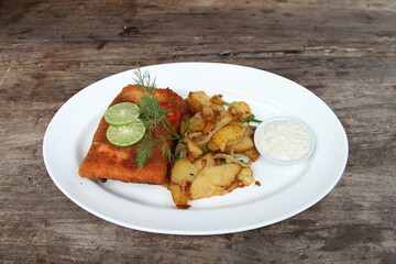 Fish & Chips. Baked barramundi with French fries and mayonnaise.