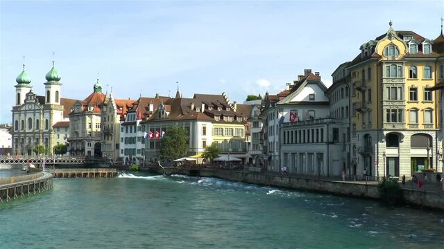 Riverfront buildings in Luzern, Lucerne, Switzerland. Jesuit Church.