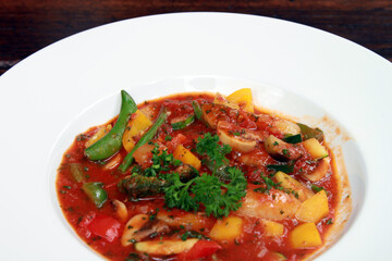 Vegetable stew on white plate