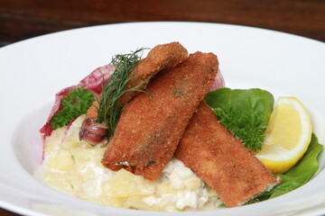 Fried herring fillets with potato salad