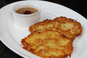 Kartoffelpuffer, German potato pancakes served with apple sauce