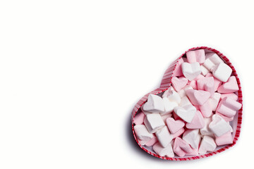 Valentine's Day, heart shaped gift boxes with small hearts inside, on a white background. Copy space.