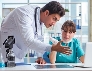 Fototapeta premium Doctor angry at his assistant due to medical error