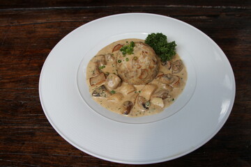 Mushrooms in cream sauce and potato dumpling. Bavarian dish