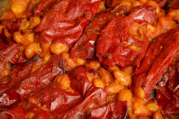 Homemade stuffed roasted red peppers with beans. Tavche gravche traditional Macedonian dish.