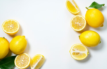 Lemons placed on a white background with copy space and cut in half