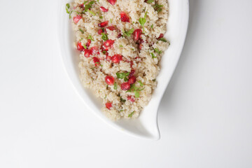 Couscous salad with pomegranate and  chopped parsley leaves