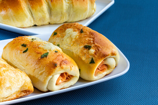 Bakery salty and buteco. Wrapped with mozzarella cheese and ham. Brazilian snack (Joelho)