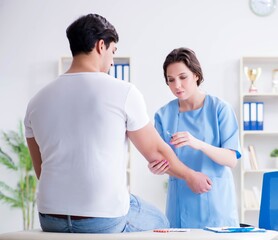 Fototapeta premium Man visiting female doctor in medical concept