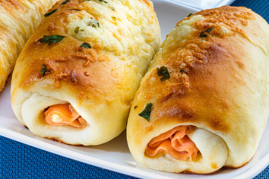 Bakery salty and buteco. Wrapped with mozzarella cheese and ham. Brazilian snack (Joelho)