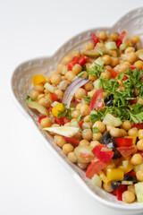 Chickpeas salad with chopped fresh vegetables