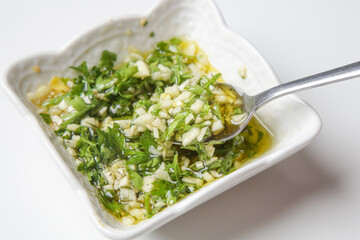 Classic Mediterranean fish dressing. Olive oil, garlic and parsley 
