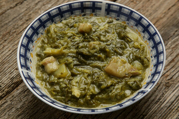 Collard dish. Delicious homemade coolard stew served in in a bowl.