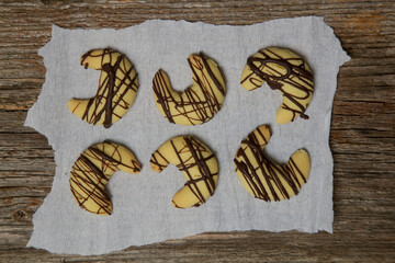 Small walnut, almond and chocolate crescent cookies