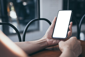 cell phone blank white screen mockup.woman hand holding texting using mobile on desk at office.background empty space for advertise.work people contact marketing business,technology