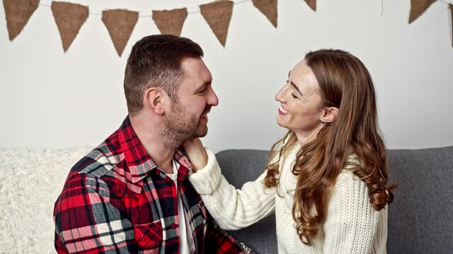 sweet kiss of young people in a warm winter evening