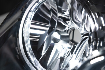 close-up element of reflector of new car headlight headlight. Car background with soft focus