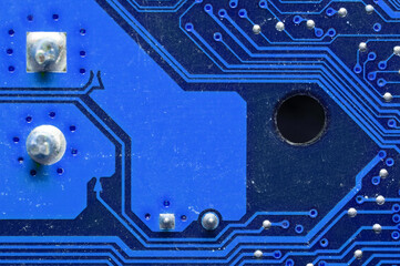 Computer circuit blue board close up. Background for the theme of electronics and computerization