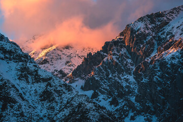 Sunset in rocky mountains with sunlit cloud of Austrian Alps in Mieming, Tyrol, Austria