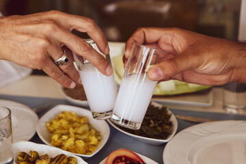 Turkish and Greek Traditional Dinning Table with Special Alcohol Drink Raki. Ouzo and Turkish Raki...