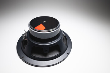 New car speakers on a white background in contrasting light. Wide angle audio background