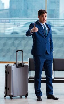 Businessman waiting at the airport for his plane in business cla
