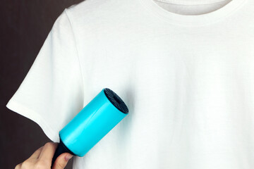 Clothing with static cling banner. White t-shirt on a dark background