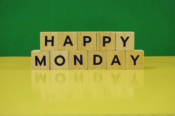 Happy Monday alphabet letter on green and yellow background