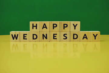 Happy Wednesday alphabet letter on green and yellow background