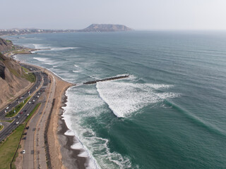 Aerial view of Green coast highway and cliff in LIma, Peru  © christian vinces