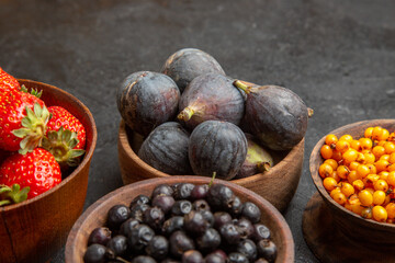 front view different fresh fruits inside plates on the dark background fruit color photo many mellow juice