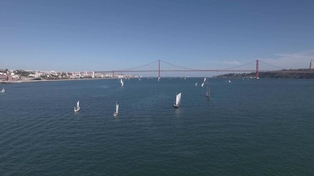 boats in a regatta in river tagus Lisbon Portugal aerial shot 4k