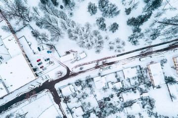 residential area with small park in winter season. aerial view from flying drone