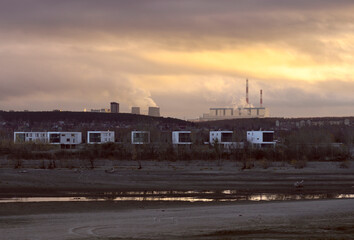 Fototapeta premium Modern houses on the sandy bank of the Ob River.