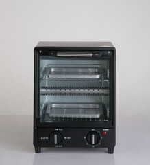 Electric small kitchen oven isolated on white