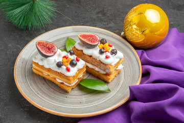 front view yummy waffle cakes with fruits on dark background photo cream sugar dessert cake sweet