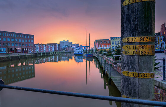 View on Christmas port of Husum with Christmas trees and beautiful sunset.