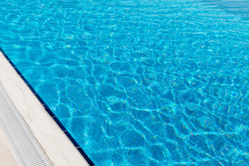 Fototapeta na wymiar Sunny swimming pool in tropical resort