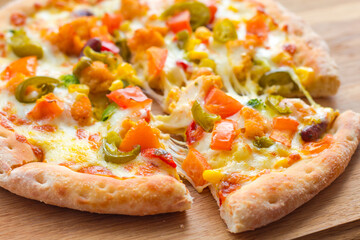 italian pizza with mozzarella, tomato and jalapeno closeup, hot mexican vegetarian pizza