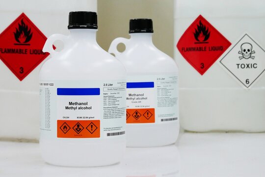 Bottle of Methanol, methyl alcohol, MeOH with Properties information and Variety type of chemical containers with its chemical hazard warning symbols. Flammable warning symbol, Toxic warning symbol.
