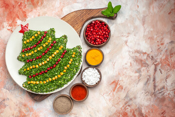 top view tasty holiday salad in new year tree shape with seasonings on light background meal photo xmas color new year