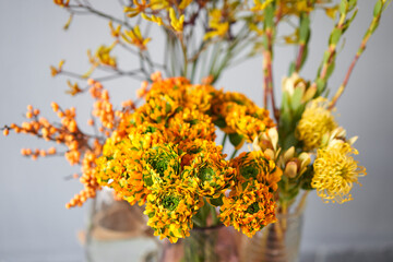 Set of yellow nd orange flowers for Interior decorations. The work of the florist at a flower shop. Fresh cut flower. European floral shop. Delivery fresh cut flower