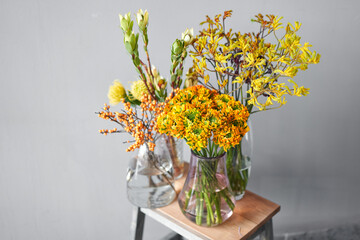 Set of yellow nd orange flowers for Interior decorations. The work of the florist at a flower shop. Fresh cut flower. European floral shop. Delivery fresh cut flower