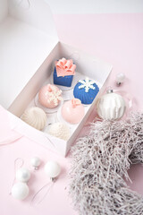 Merry Christmas card. Variety of sweet delicious cakes. Fir branches on a gray background. Merry Christmas card. New year mood