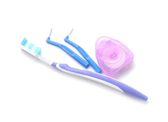 Toothbrushes for dental braces and floss on white background