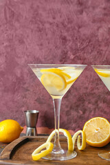 Glass of fresh martini on dark background