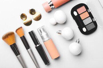 Christmas composition with cosmetics on white background