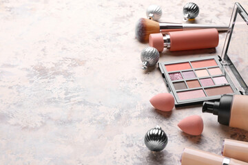 Christmas composition with cosmetics on light background